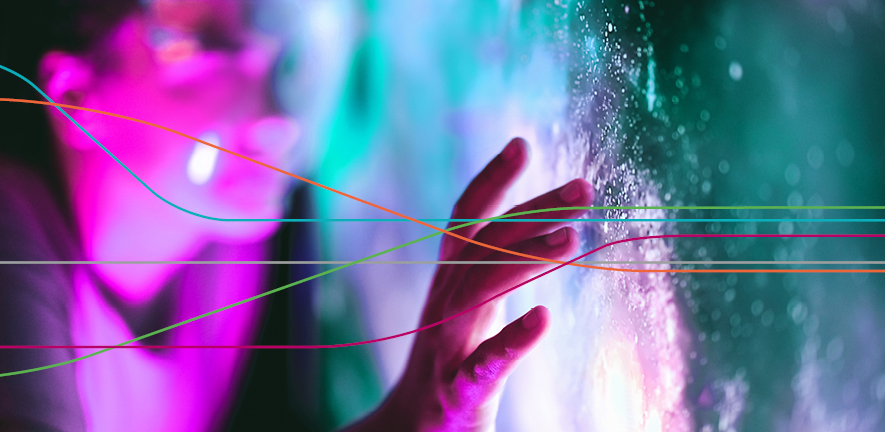 Close-up of a hand touching a brightly lit, textured surface with glowing pink and teal lights in the background, overlaid by several thin, multicoloured curved lines