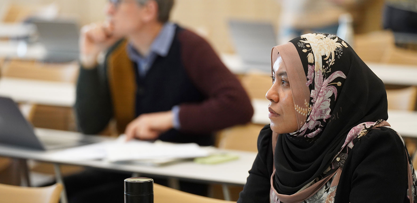 Student attending graduate programme lecture