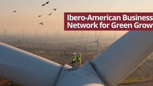 Workers inspecting wind turbine infrastructure at sunset, representing renewable energy development and the Ibero‑American Business Network for Green Growth.