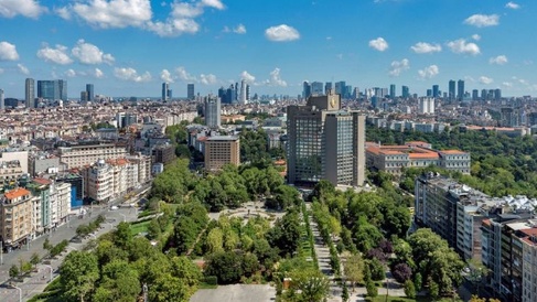 View of Istanbul cityscape, with green space in front of city buildings