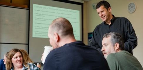 Tim Forman speaking to a group of students 