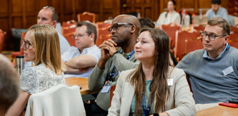 Postgraduate students watching a presentation