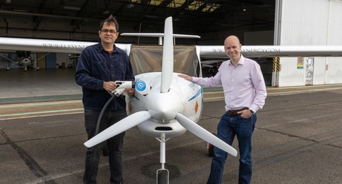 Dr Deepanshu Singh and CISL's Eliot Whittington pose with the electric plane