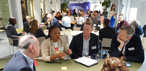 Course delegates in small discussion groups.