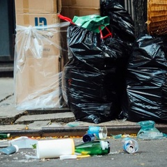 Rubbish in bags lying in the street