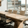 Boardroom table next to a sunny window