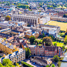 An aerial view of the Cambridge colleges and the backs in the sun.