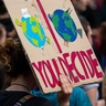 Climate protestors with signs