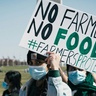 Farming protest in Washington DC. People with flags and placards saying 'No Farming No Food'