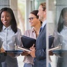 Group of business leaders meeting outside a building