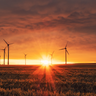 Wind turbines at sunset. Image by Karsten Wuerth (unsplash)