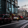 London street scene with taxi and 30 St Mary Axe, The Gherkin, on the skyline.