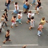 Aerial view of protestors walking down a road
