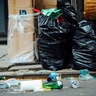 Rubbish in bags lying in the street