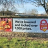 Banners outside supermarket