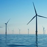 Wind turbines standing in blue sea off the coast of southern England