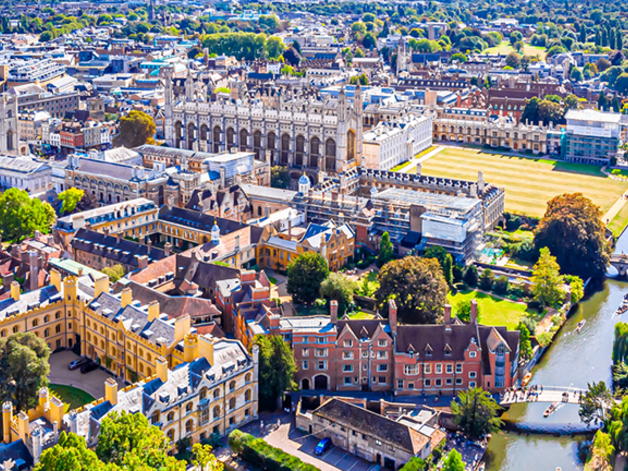 An aerial view of the Cambridge colleges and the backs in the sun.