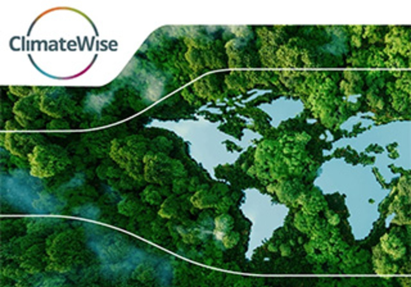 A dense green forest canopy forms a natural frame around an opening shaped like a world map, with blue ocean areas and green continents visible through the gap. In the upper left corner, the “ClimateWise” logo appears with a circular multicolored ring around it.