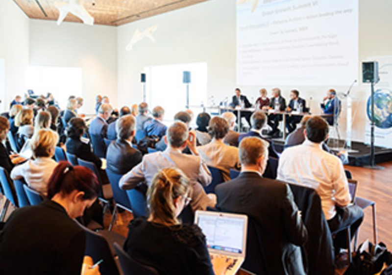 Business leaders and policy experts participating in a sustainability forum focused on climate policy, corporate leadership, net zero transition and sustainable economic development.