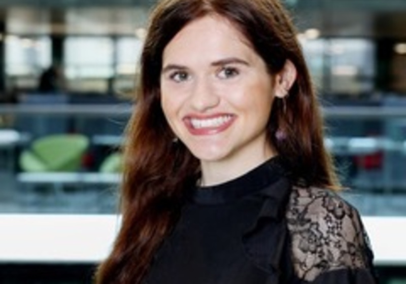 A woman smiling at the camera