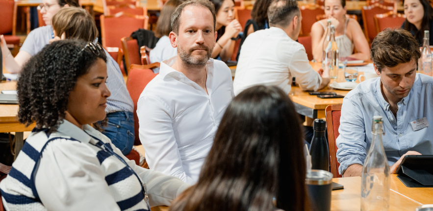 PCSB students sat around a table at a workshhop