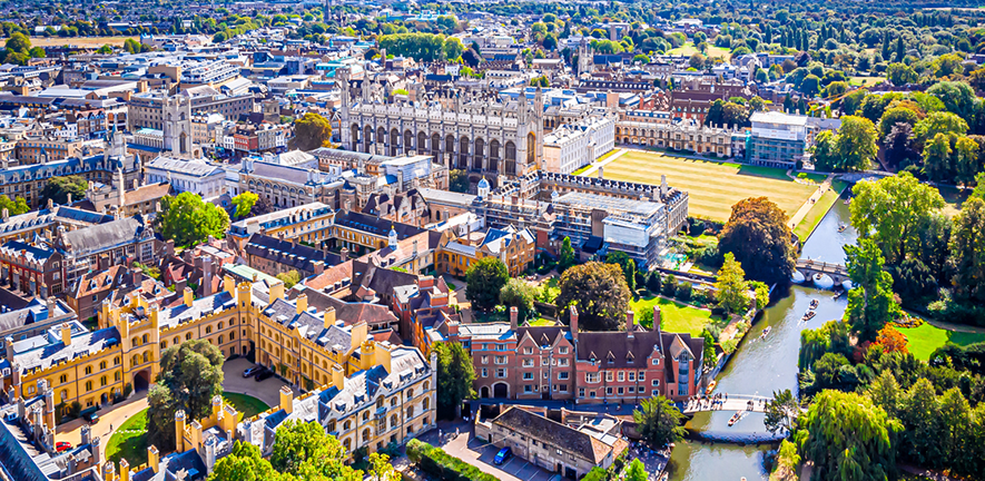 An aerial view of the Cambridge colleges and the backs in the sun.