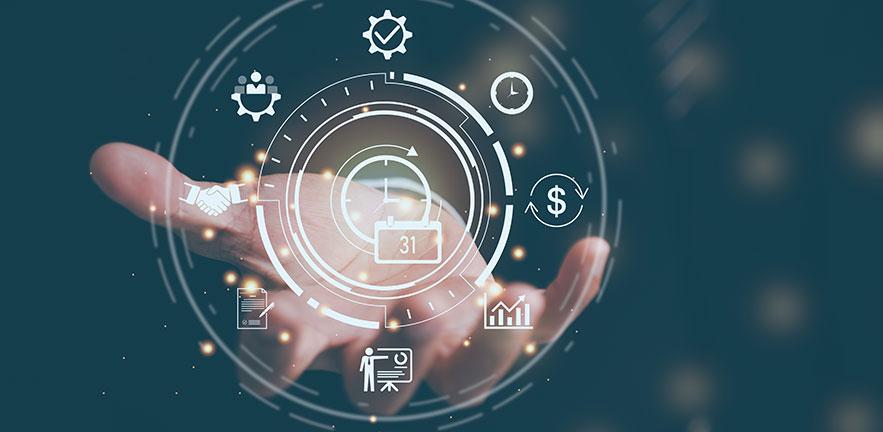 A hand is held out against a dark teal background with glowing digital interface graphics hovering above it. The interface features circular HUD-style elements and various white icons, including a calendar, a clock, a dollar symbol, a bar chart, a handsha