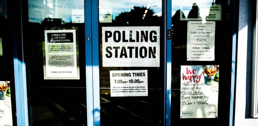 Doors of community centre with 'Polling Station' signs. Photo by Elliott Stallion on Unsplash Doors of community centre with 'Polling Station' signs