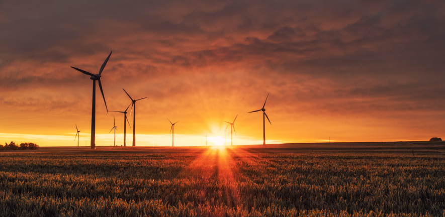 Wind turbines at sunset. Image by Karsten Wuerth (unsplash)