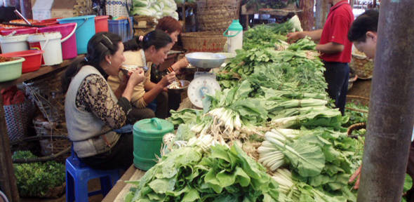 Women eating at a food market in China